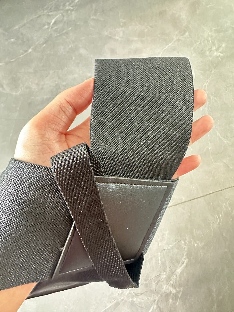 Customer review: ALIGNR elastic cross strap and center patch detail in hand